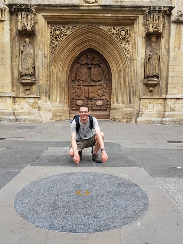 I made it! Me outside Bath Abbey with the Cotswold Way marker stone